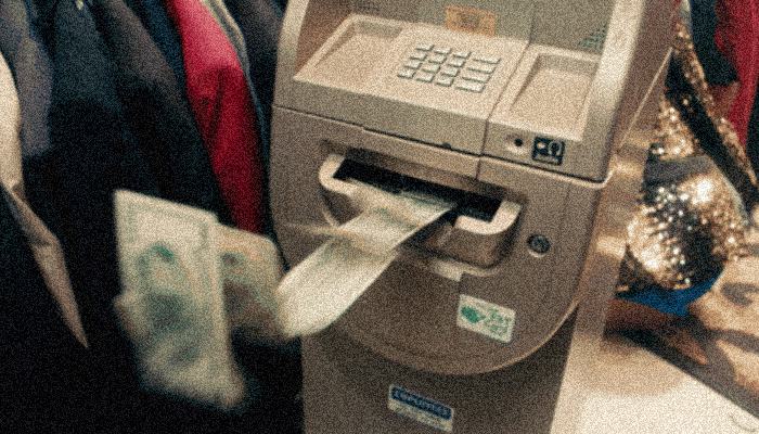 An ATM that withdraws bills at fast speed with no human behind, to illustrate the cyberattack made by Carbanak 