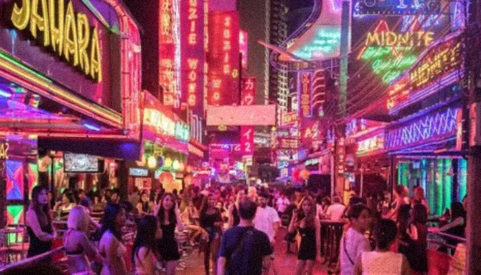 Soi Cowboy in Bangkok, with glowing pink neons for bar and nightclub, to showcase how cyberpunk this district can be